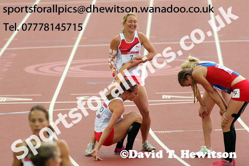 Helping hand at the end  of the 800 metres heptathlon at the Commonwealth Games, Glasgow. Photo: David T. Hewitson/Sports for All Pics